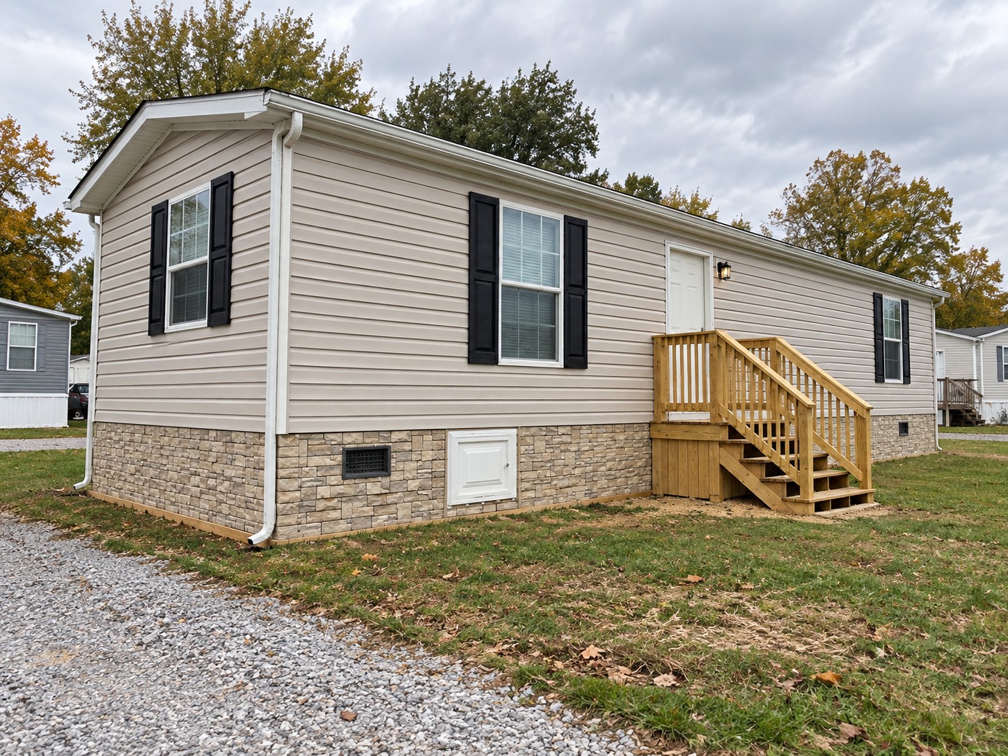 Illustrative single-wide with Novik-style faux stacked stone skirting
