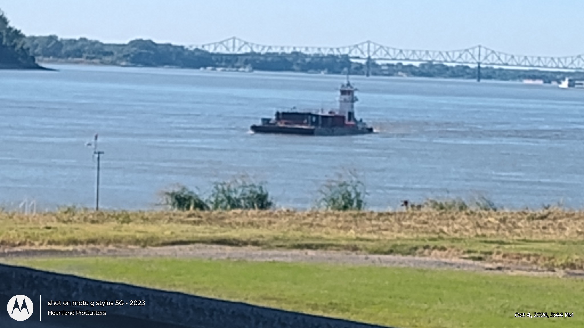 Towboat and distant bridge near the Ohio and Mississippi river confluence